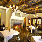The elaborate painted ceiling in the dining room at The Willows Historic Palm Springs Inn