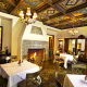 The elaborate painted ceiling in the dining room at The Willows Historic Palm Springs Inn