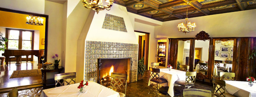 The elaborate painted ceiling in the dining room at The Willows Historic Palm Springs Inn