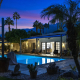 The illuminated pool at the Desert Paradise Resort for gay men in Palm Springs, California