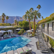 A staircase leads guests up to the second floor of comfortable poolside rooms at the Descanso Resort in Palm Springs, California