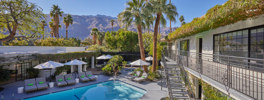 A staircase leads guests up to the second floor of comfortable poolside rooms at the Descanso Resort in Palm Springs, California