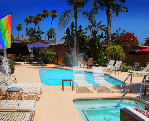 The Triangle Inn pool and spa on a bright sunny day in Palm Springs, California