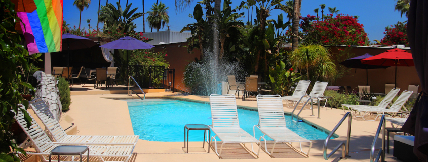 The Triangle Inn pool and spa on a bright sunny day in Palm Springs, California