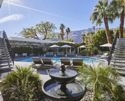 A fountain with bubbling water helps keep the pool area at Descanso Resort in Palm Springs calm and serene