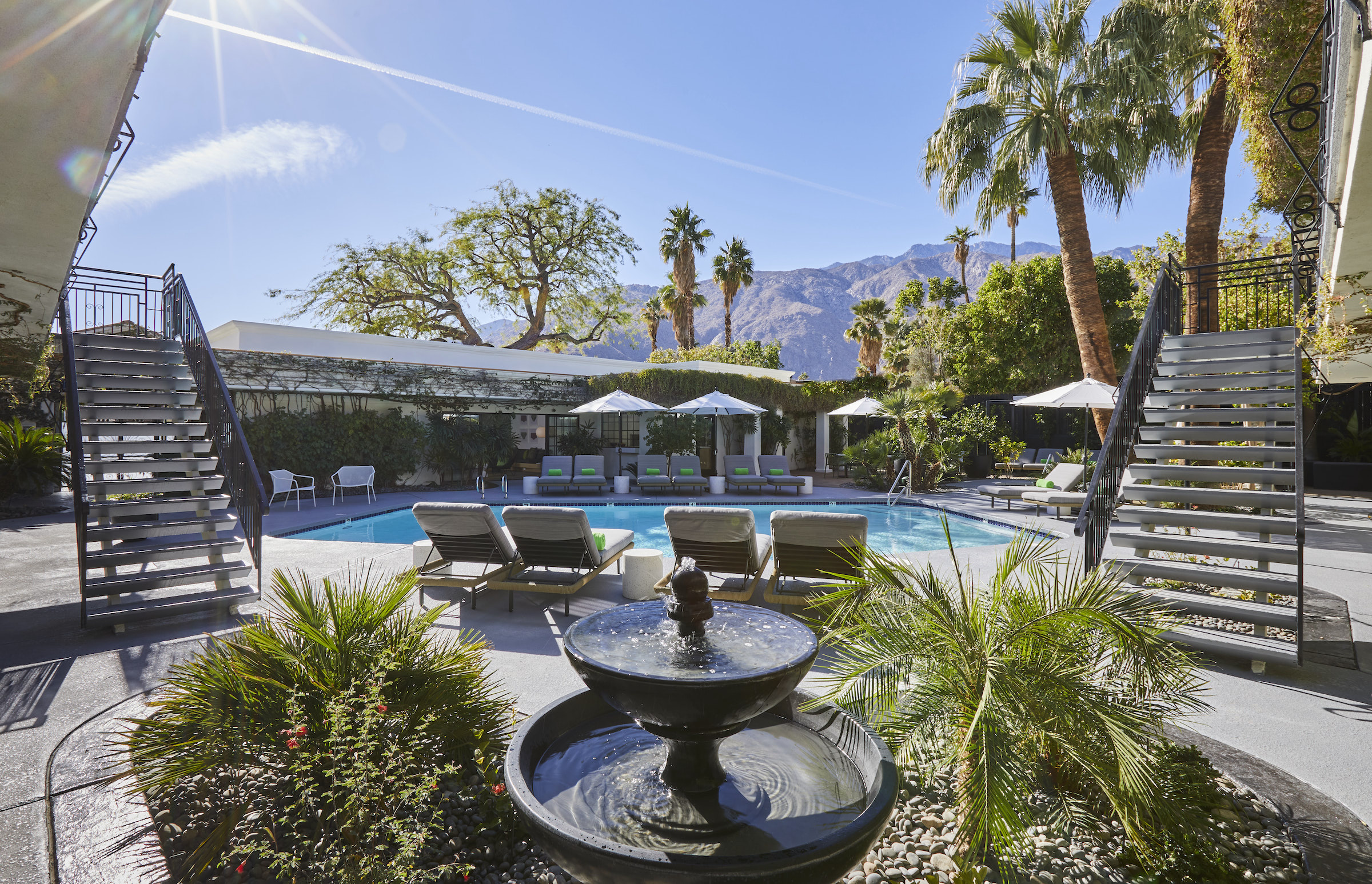 A fountain with bubbling water helps keep the pool area at Descanso Resort in Palm Springs calm and serene