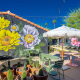 A giant mural of yellow and blue flowers at Fleur Noire Hotel in Palm Springs, California