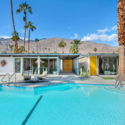 The huge sparkling pool in the back of Limón Palm Springs boutique hotel in Palm Springs, California