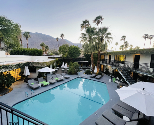 The pool at Descanso Resort in Palm Springs, California, is surrounded by comfortable lounge chairs and wide umbrellas