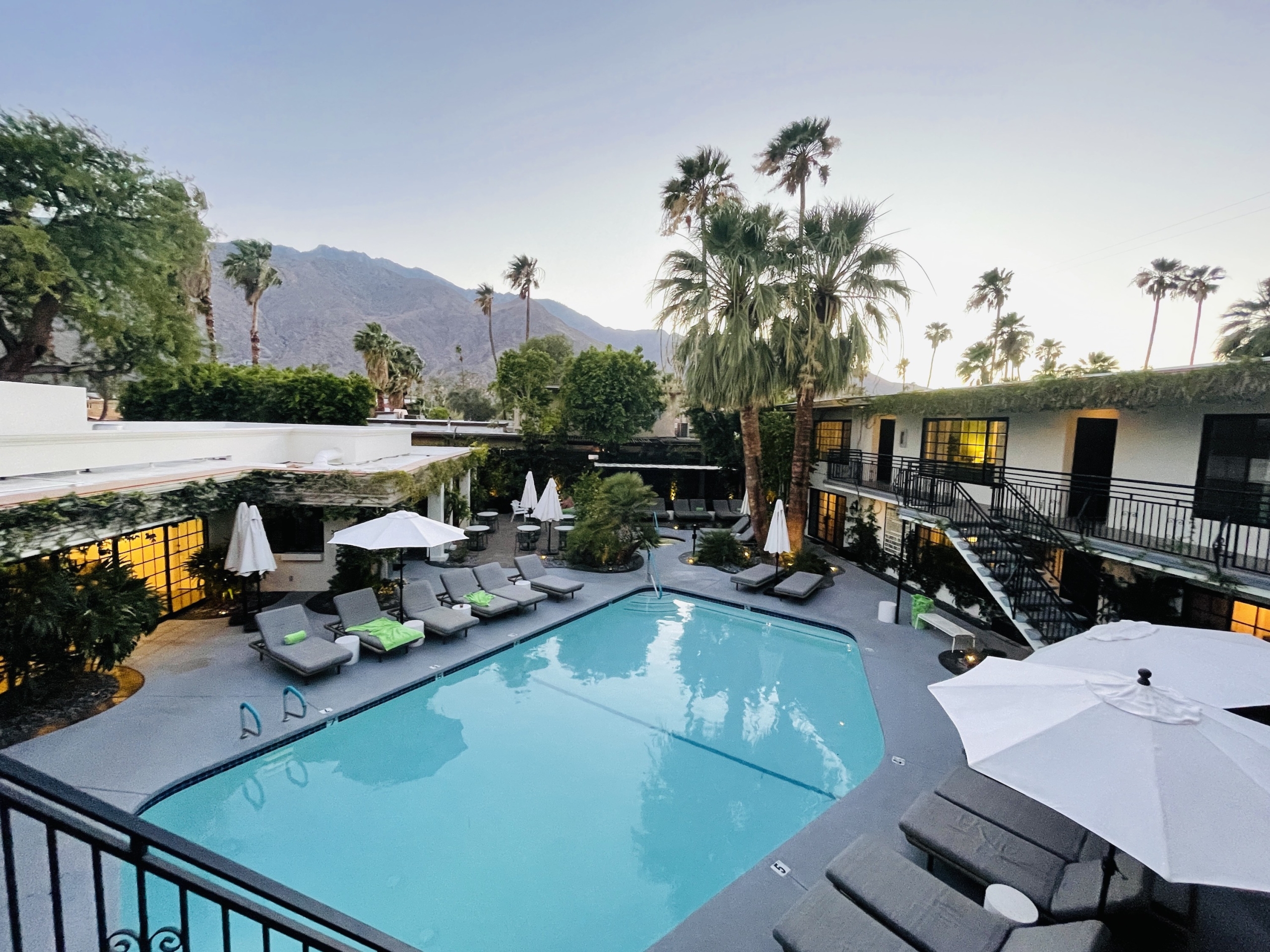 The pool at Descanso Resort in Palm Springs, California, is surrounded by comfortable lounge chairs and wide umbrellas