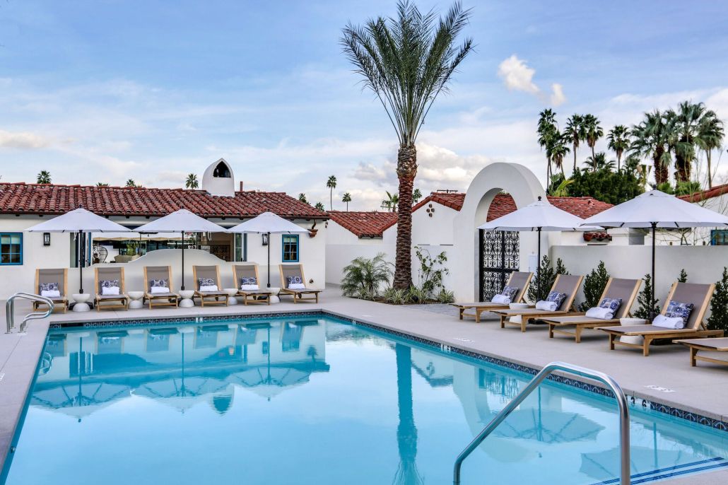 The pool at La Serena Villas in Palm Springs, California, is surrounded by lounge chairs and palms