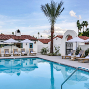 The pool at La Serena Villas in Palm Springs, California, is surrounded by lounge chairs and palms