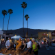 People look at items for sale as night falls over the Village Fest street fair in Palm Springs