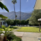 The grassy courtyard area at the Azure Sky boutique hotel in Palm Springs, California