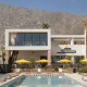 The pool surrounded by yellow umbrellas at the Drift Hotel in Palm Springs, California
