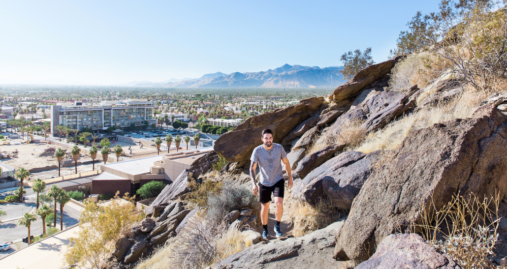 A man hikes on a mountain in Palm Springs