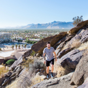 A man hikes on a mountain in Palm Springs