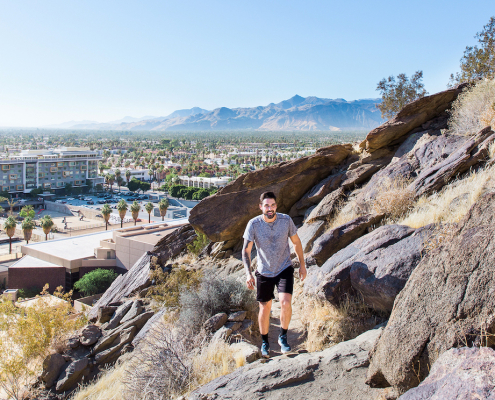 A man hikes on a mountain in Palm Springs