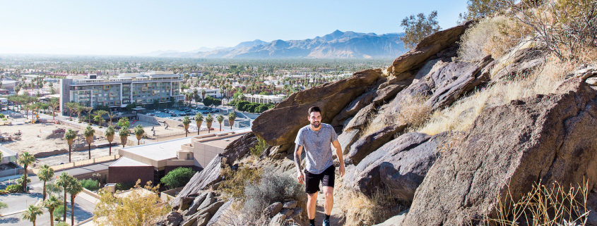 A man hikes on a mountain in Palm Springs