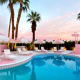 Cotton candy skies above the sparkling pool at the Trixie Motel in Palm Springs, California