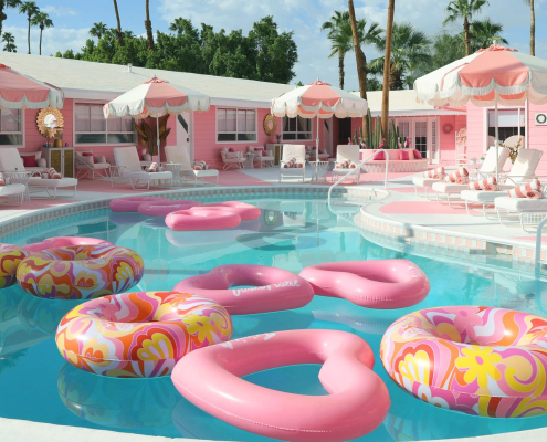 Pink heart shaped floats in the kidney-shaped pool at the Trixie Motel in Palm Springs, California