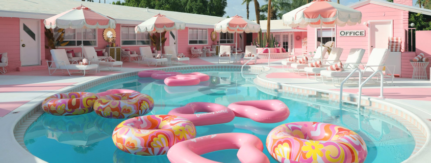 Pink heart shaped floats in the kidney-shaped pool at the Trixie Motel in Palm Springs, California