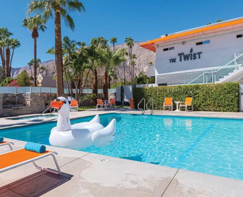 A white swan float in the pool at The Twist Palm Springs boutique hotel