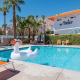 A white swan float in the pool at The Twist Palm Springs boutique hotel