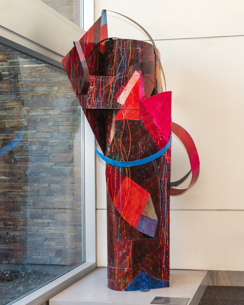 A red and blue metal sculpture by Tom Holland at the Palm Springs International Airport