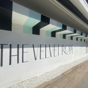 The striped front wall of The Velvet Rope hotel in Palm Springs, California