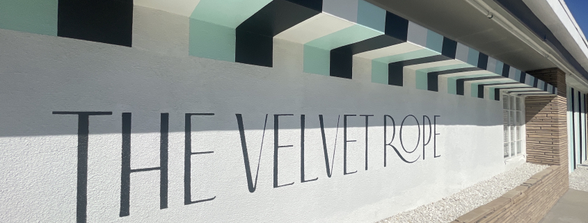 The striped front wall of The Velvet Rope hotel in Palm Springs, California