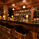 The bar at the Del Rey with liquor bottles on the glass shelves