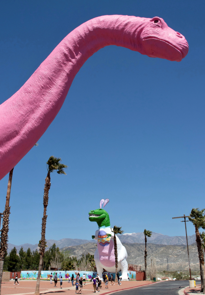 The giant pink dinosaur in Cabazon, California, with the T-Rex behind it