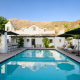 The pool at The Lucille Palm Springs with the San Jacinto Mountains in the background