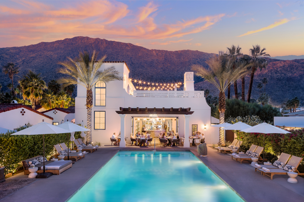 A view of the pool at La Serena Villas in Palm Springs, California, at sunset with the San Jacinto Mountains in the background