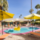 Yellow umbrellas surround the pool at El Noa Noa