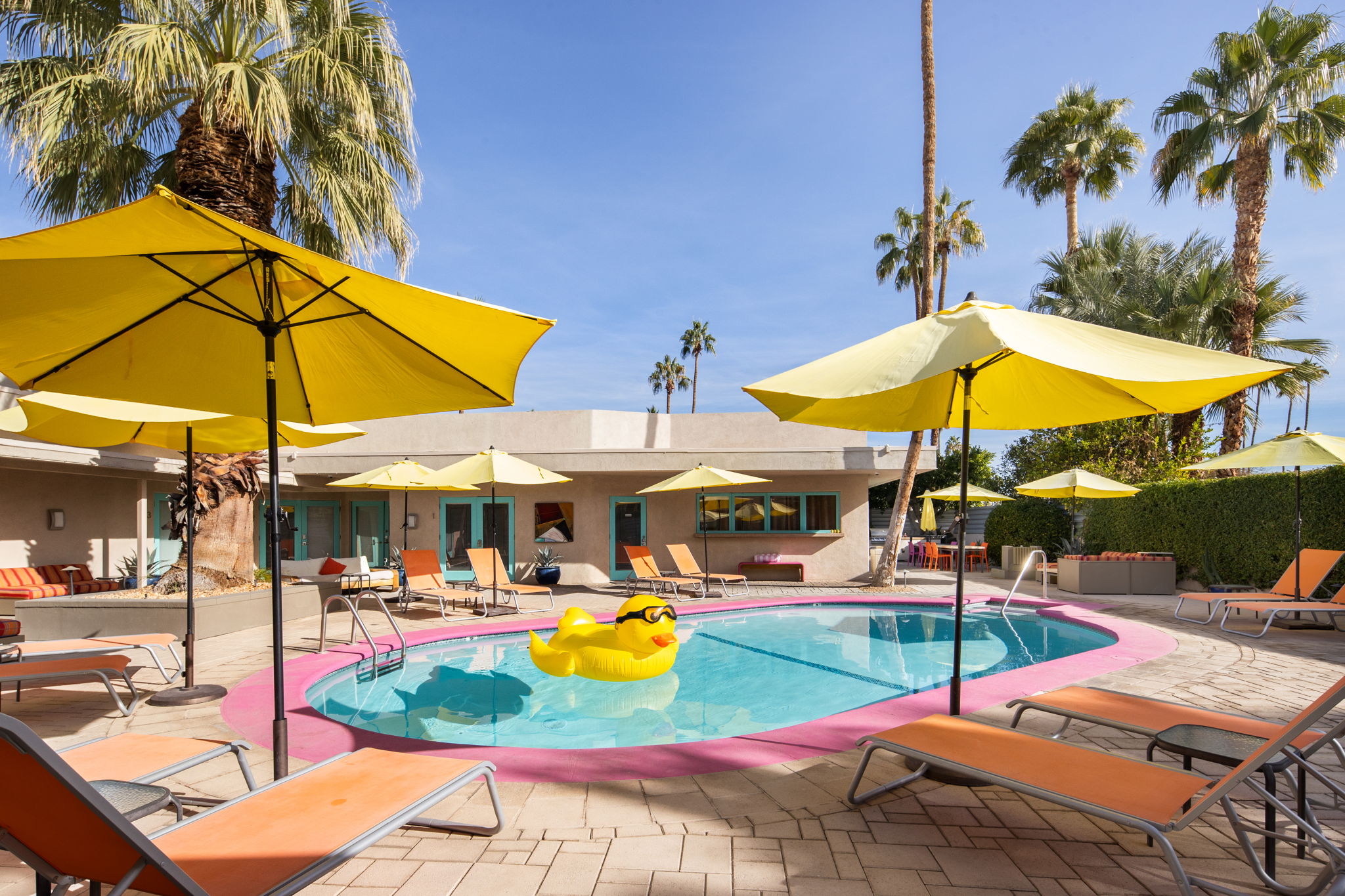 Yellow umbrellas surround the pool at El Noa Noa