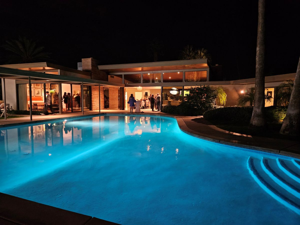 The pool at Frank Sinatra's Palm Springs house illuminated at night