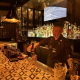 A bartender at Seymour's pours a drink behind the bar