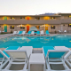 The large pool at The Cole Hotel at sunset in Palm Springs, California