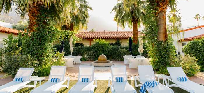 Lounge chairs at Alcazar Palm Springs to enjoy the California sun