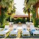 Lounge chairs at Alcazar Palm Springs to enjoy the California sun