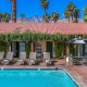 Greenery surrounds the large pool at La Maison Hotel in Palm Springs, California